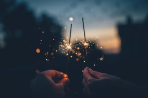 A couple holding sparklers