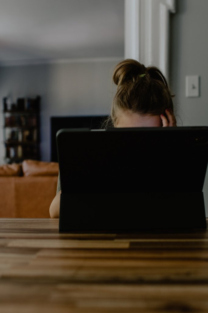 Frustrated woman staring at her tablet