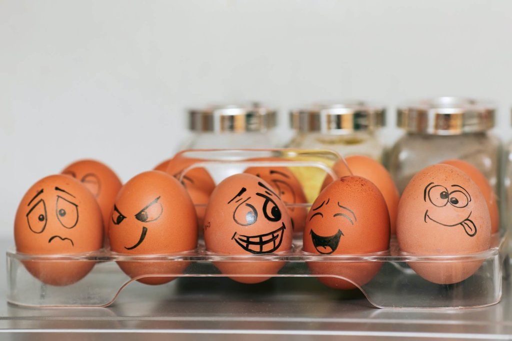 10 eggs with different faces drawn on each one representing a different emotion